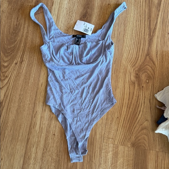 Baby blue body suit from Forever 21. Never worn. Size M - Picture 2 of 4
